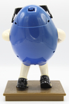 Blue M&M Figure on Pedestal (full rear view) by Mars, Incorporated
