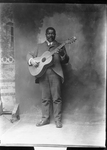 Man Standing with Guitar [member of Polk Miller's Old South Quartette]