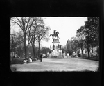 Washington by Crawford, looking east; Woman sitting on bench at left; Man standing on path