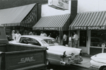 People standing near Southside Business Machines, Farmville, Va., July 1963, #002