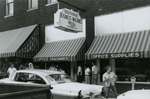 People standing near Southside Business Machines, Farmville, Va., July 1963, #001