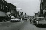 Police officer and pedestrians on Main Street, Farmville, Va., July 1963, #002
