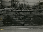 Swastika painted on wall on Madison Street, Farmville, Va., June 1962, #002