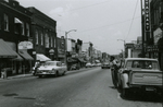 View of police officer and Main Street looking north, Farmville, Va., July 1963