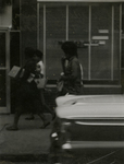 Women walking along street, Farmville, Va., June 1962