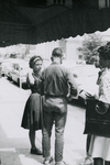 People standing near Southside Sundry, Farmville, Va., July 1963, #002