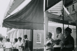 People standing near Southside Sundry, Farmville, Va., July 1963, #001