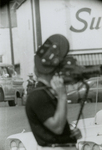 Man with camera at Grants/Safeway, Farmville, Va., August 1963, #001