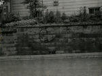 Swastika painted on wall on Madison Street, Farmville, Va., June 1962, #001