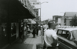 People standing near Southside Sundry, Farmville, Va., July 1963, #005