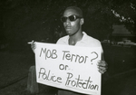 Protester with sign, unknown Virginia location, [undated], #011
