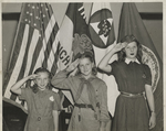 Three Girl Scouts Saluting